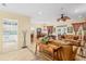 Open-concept layout with the living room flowing into the dining area and kitchen, great for entertaining at 12239 Se 92Nd Court Rd, Summerfield, FL 34491