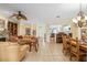 Open-concept living space showcasing the living and dining areas with natural light at 12239 Se 92Nd Court Rd, Summerfield, FL 34491