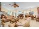 Spacious open floor plan featuring dining and living areas, creating a welcoming ambiance at 12239 Se 92Nd Court Rd, Summerfield, FL 34491