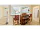 Kitchen pass-through with wet bar and music room in background at 12239 Se 92Nd Court Rd, Summerfield, FL 34491