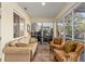 Beautiful sunroom with great natural light and comfortable seating at 12239 Se 92Nd Court Rd, Summerfield, FL 34491