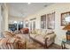 Spacious sunroom with tile floors, couches and great lighting at 12239 Se 92Nd Court Rd, Summerfield, FL 34491