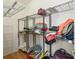 Spacious walk-in closet with metal shelving providing ample storage for clothes, shoes and accessories at 12239 Se 92Nd Court Rd, Summerfield, FL 34491
