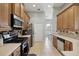Spacious kitchen featuring stainless steel appliances and ample counter space with tile backsplash at 13101 Biscayne Dr, Grand Island, FL 32735