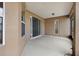 Covered back patio with concrete floors and access to the home's interior at 13101 Biscayne Dr, Grand Island, FL 32735