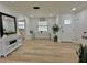 Bright living room with shiplap walls, bench seating, and natural light at 14598 Sw 34Th Ter Rd, Ocala, FL 34473