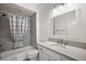 Bathroom with modern vanity and a shower/bath tub combination with gray tiling at 1581 Rowell St, The Villages, FL 34762