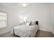 Cozy bedroom featuring a comfortable bed, neutral decor, and ample natural light at 1581 Rowell St, The Villages, FL 34762