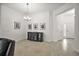 Dining area featuring a decorative light fixture, neutral color palette, and tile floors at 1581 Rowell St, The Villages, FL 34762