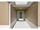 Inviting front entrance featuring decorative door, neutral stucco, and a covered entryway at 1581 Rowell St, The Villages, FL 34762