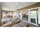 Inviting lanai with comfortable seating and seamless indoor-outdoor flow to the kitchen at 1581 Rowell St, The Villages, FL 34762