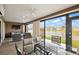 Spacious lanai with serene lake view, comfortable seating, and modern ceiling fans at 1581 Rowell St, The Villages, FL 34762
