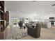Bright and airy living space showcasing a spacious layout, tile flooring, and modern decor at 1581 Rowell St, The Villages, FL 34762