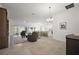Bright living room showcasing an open floor plan, tile flooring, and natural light at 1581 Rowell St, The Villages, FL 34762