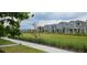 Picturesque view of a neighborhood with well-maintained lawns and attractive homes at 1723 Happiness Row, Kissimmee, FL 34744