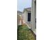 Side yard showcasing the fence line, and exterior features of the home at 1723 Happiness Row, Kissimmee, FL 34744