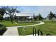 A lovely community park includes picnic tables under a covered gazebo and charcoal grills at 1723 Happiness Row, Kissimmee, FL 34744