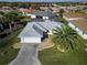 Aerial view of a single-Gathering home with a pool and landscaped yard at 17490 Se 110Th Ter, Summerfield, FL 34491