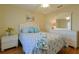 Bright bedroom with a queen bed, matching nightstand, and dresser at 17490 Se 110Th Ter, Summerfield, FL 34491
