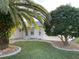 Charming home exterior featuring a well-maintained lawn and mature landscaping at 17490 Se 110Th Ter, Summerfield, FL 34491