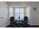 Bright kitchen nook with a bistro table set by a window with blinds, offering a cozy spot for morning coffee at 17490 Se 110Th Ter, Summerfield, FL 34491