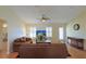 Cozy living room with shuttered windows, neutral walls, and comfortable seating at 17490 Se 110Th Ter, Summerfield, FL 34491