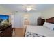 Spacious bedroom with hardwood floors and access to the bathroom at 17490 Se 110Th Ter, Summerfield, FL 34491