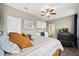 Secondary bedroom featuring a wet bar, ceiling fan, TV, and cozy recliner at 17648 Live Oak Dr, Tavares, FL 32778
