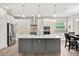 Well-lit kitchen with stainless steel appliances and a large center island at 17648 Live Oak Dr, Tavares, FL 32778