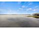 Beautiful lake view featuring a calm lake under a blue sky with sparse clouds at 17648 Live Oak Dr, Tavares, FL 32778