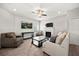 Cozy living room with a ceiling fan, a fireplace, and comfortable furnishings at 17648 Live Oak Dr, Tavares, FL 32778