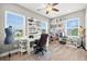 Craft room features ample shelving, multiple windows, and a sewing/crafting station at 17648 Live Oak Dr, Tavares, FL 32778