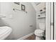 Powder room with a unique bowl sink, modern toilet, and light gray paint at 17648 Live Oak Dr, Tavares, FL 32778