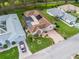 Aerial view of a single-Gathering home with screened pool, brick driveway, and landscaped yard at 17728 Se 115Th Ct, Summerfield, FL 34491