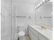 Contemporary bathroom with a walk-in shower, toilet, and vanity with a sink at 17728 Se 115Th Ct, Summerfield, FL 34491