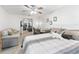 Carpeted bedroom features versatile spaces, including an office area, sitting area, and easy access to the kitchen at 17728 Se 115Th Ct, Summerfield, FL 34491