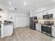 Modern kitchen with stainless steel appliances, granite countertops, and ample cabinet space at 17728 Se 115Th Ct, Summerfield, FL 34491