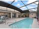 A private pool is surrounded by a patio, and is accessible from multiple points in the home at 17728 Se 115Th Ct, Summerfield, FL 34491