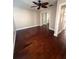 Bedroom features wood floors, mirrored closet and trim at 1945 Maple Cir # 45E, Tavares, FL 32778