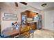 Cozy dining area featuring wood floors, a breakfast nook, and stainless steel appliances at 1945 Maple Cir # 45E, Tavares, FL 32778
