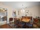 Formal dining room with wood floors, elegant chandelier, and classic furnishings at 1945 Maple Cir # 45E, Tavares, FL 32778