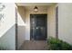 Close-up of front door with decorative accents and overhead light fixture at 1945 Maple Cir # 45E, Tavares, FL 32778
