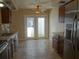 Open concept kitchen with stainless steel appliances, granite countertops, and access to the backyard at 1945 Maple Cir # 45E, Tavares, FL 32778