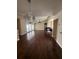 Spacious living room featuring hardwood floors, vaulted ceilings, chandelier and large windows at 1945 Maple Cir # 45E, Tavares, FL 32778
