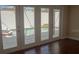 View of private pool and spa area through interior french doors, providing seamless indoor-outdoor living at 1945 Maple Cir # 45E, Tavares, FL 32778
