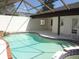 Lovely in-ground pool and spa enclosed in screened lanai for year-round enjoyment at 1945 Maple Cir # 45E, Tavares, FL 32778