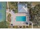 Overhead view of community pool, tennis courts and lounge areas at 19666 Sw 88Th Loop, Dunnellon, FL 34432