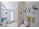 Bathroom has a toilet, sink, mirror, and a door to the outside at 19666 Sw 88Th Loop, Dunnellon, FL 34432