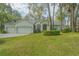 Charming single-story home features a three-car garage and well-manicured lawn at 19666 Sw 88Th Loop, Dunnellon, FL 34432