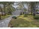Beautiful home with a well manicured front lawn, and a three car garage at 19666 Sw 88Th Loop, Dunnellon, FL 34432